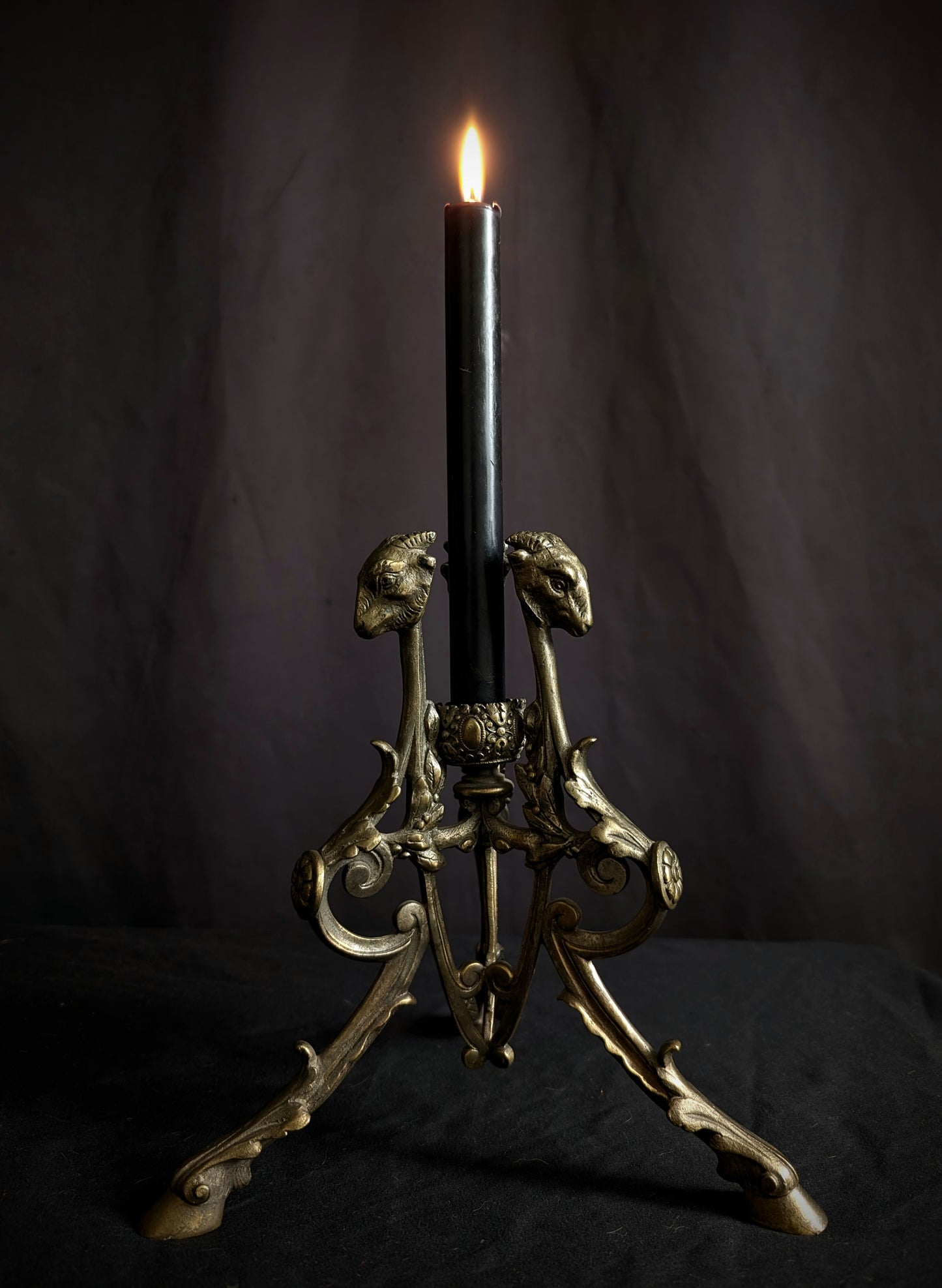 Antique candlestick with goats