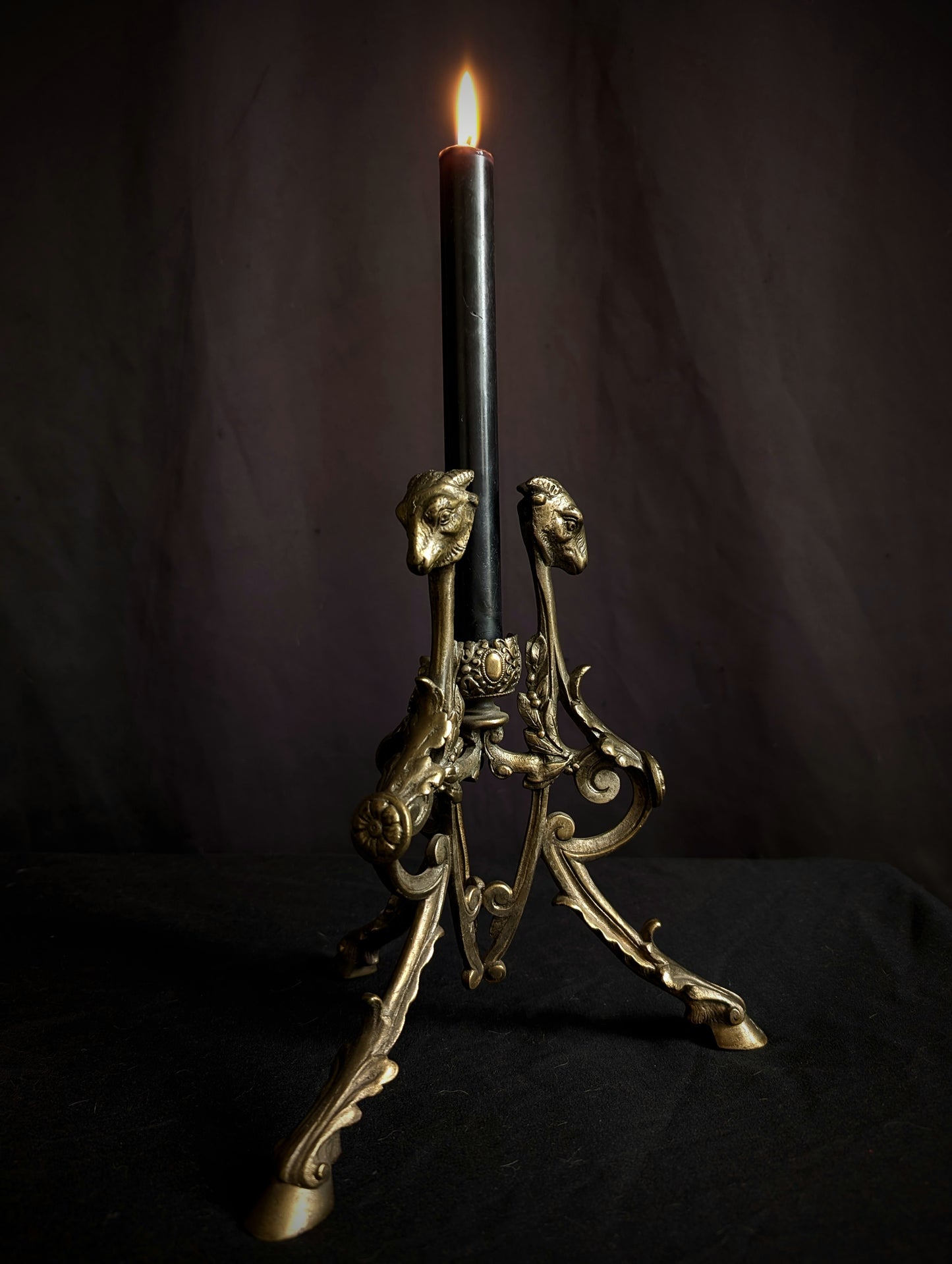 Antique candlestick with goats