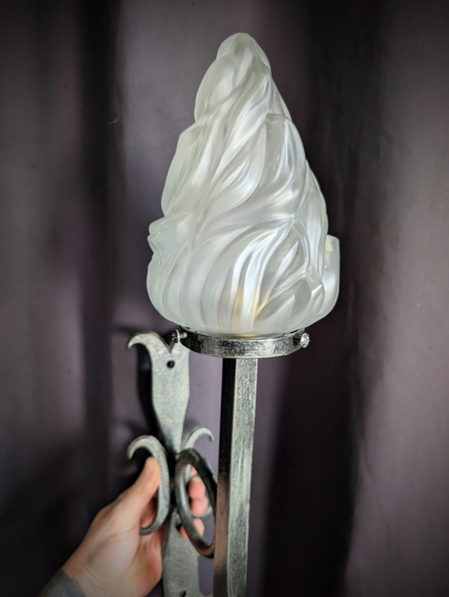 Wrought iron torch with glass flame