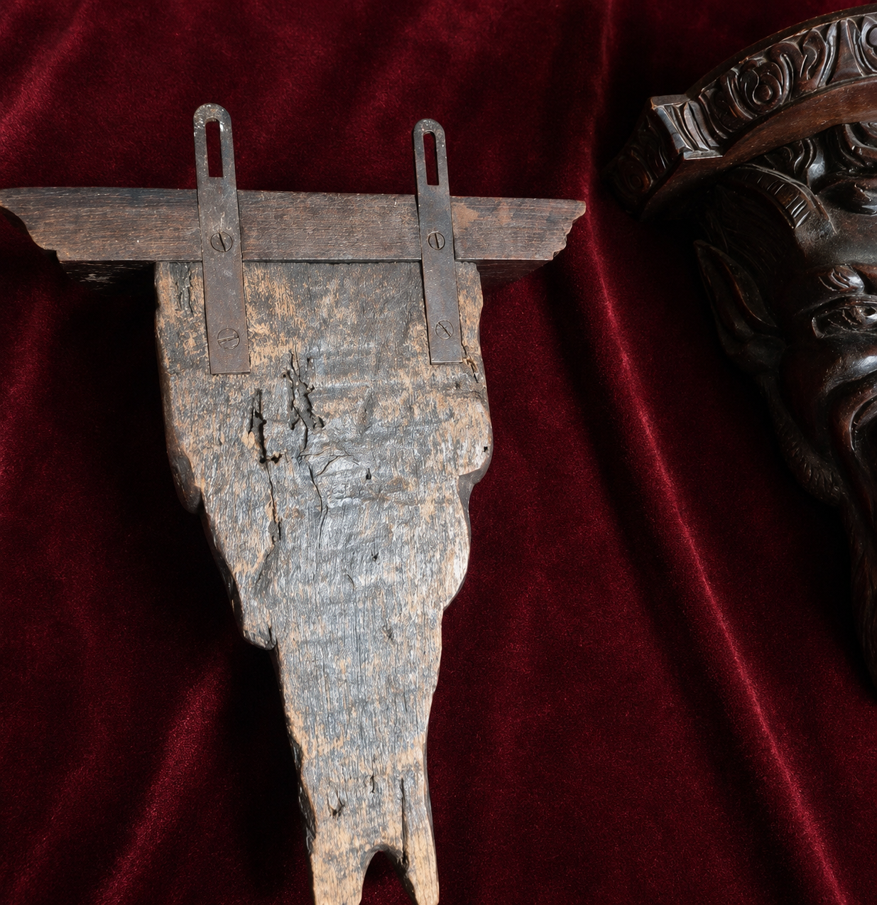 A magnificent pair of 19th century carved wooden wall consoles depicting Satyr faces