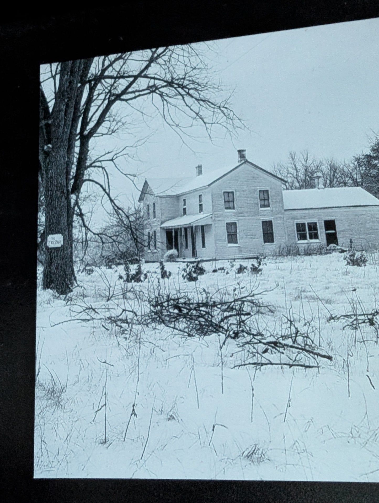 Piece of ED GEIN's infamous Plainfield farm in a frame with photo