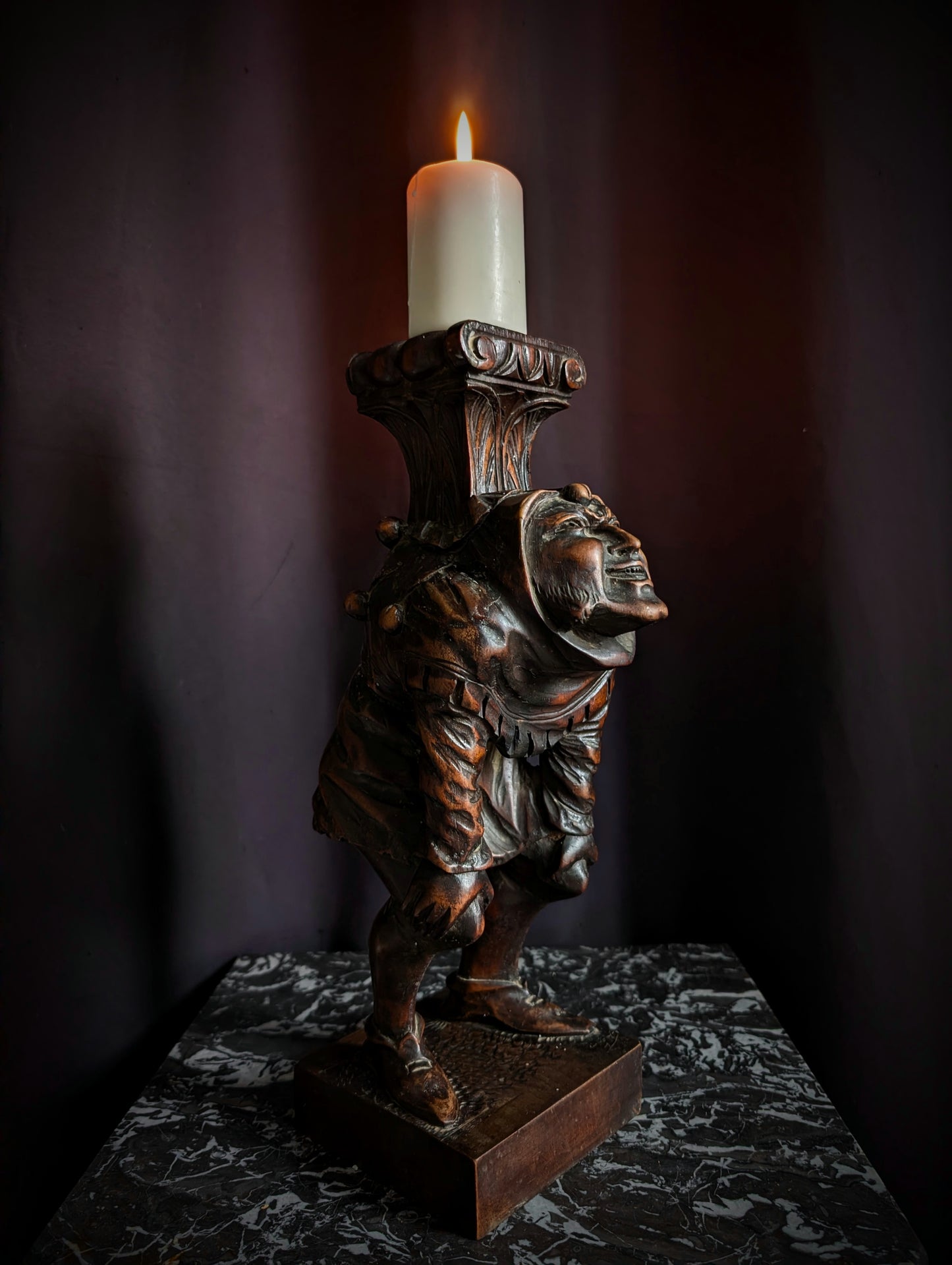 Antique wooden candlestick carved with a hunchback (Quasimodo) from the 19th century (1860s)