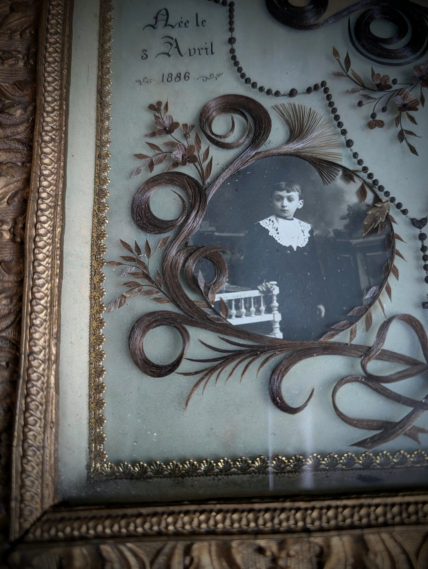 A magnificent antique Reliquary frame containing the hair of a mother and her two children, who passed away in France during the First World War in 1916.