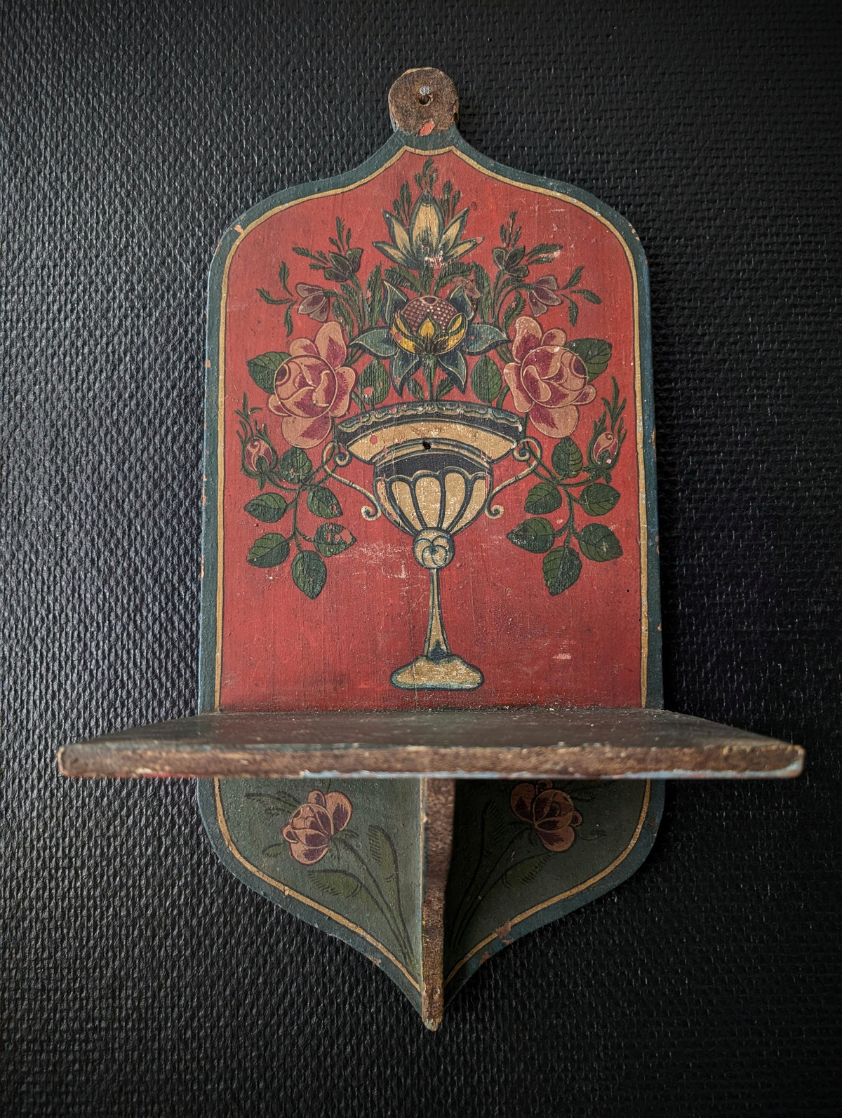 Sectioned skull from a private collection belonging to a doctor in Germany, 1915. Displayed on an antique Alpine folk art painted wooden wall shelf (Bauernmalerei)