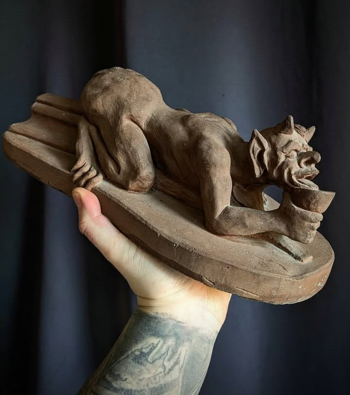 Sculpture of the Devil with a chalice (made of church stone)