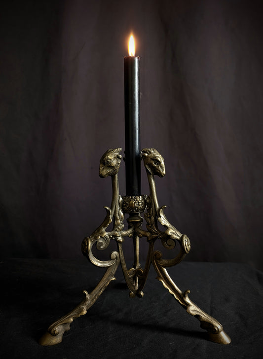 Antique candlestick with goats