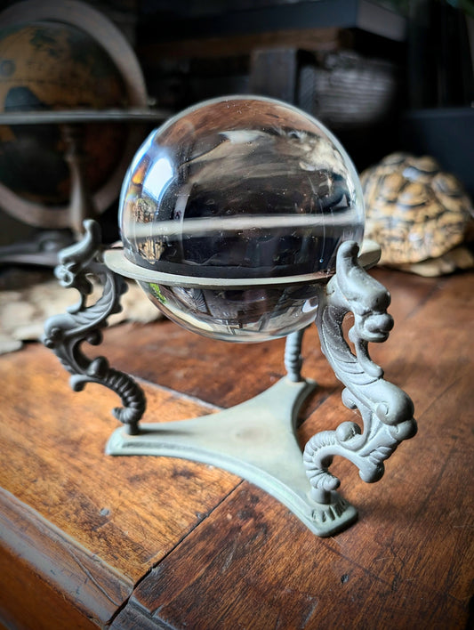 Vintage crystal ball with chimeras