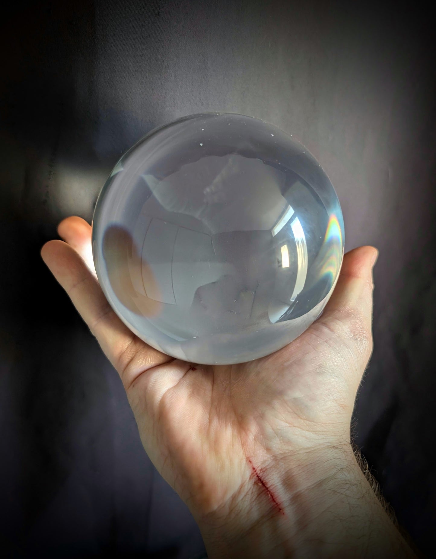 A beautiful crystal ball on a pedestal with Chimeras (30cm)