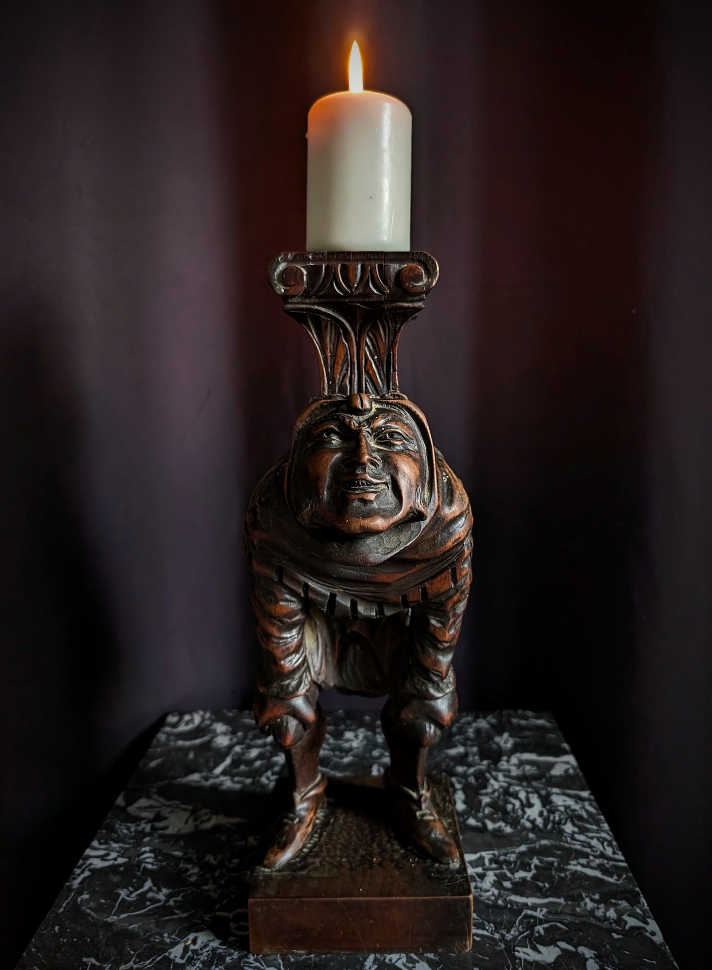 Antique wooden candlestick carved with a hunchback (Quasimodo) from the 19th century (1860s)