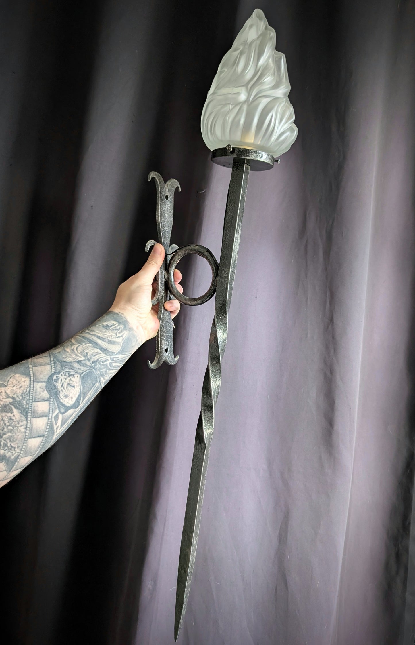 Wrought iron torch with glass flame