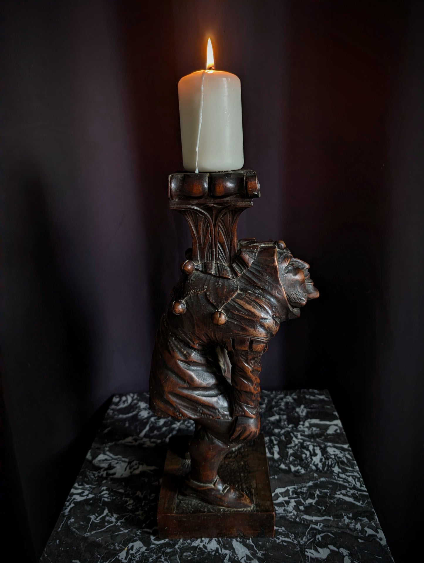 Antique wooden candlestick carved with a hunchback (Quasimodo) from the 19th century (1860s)