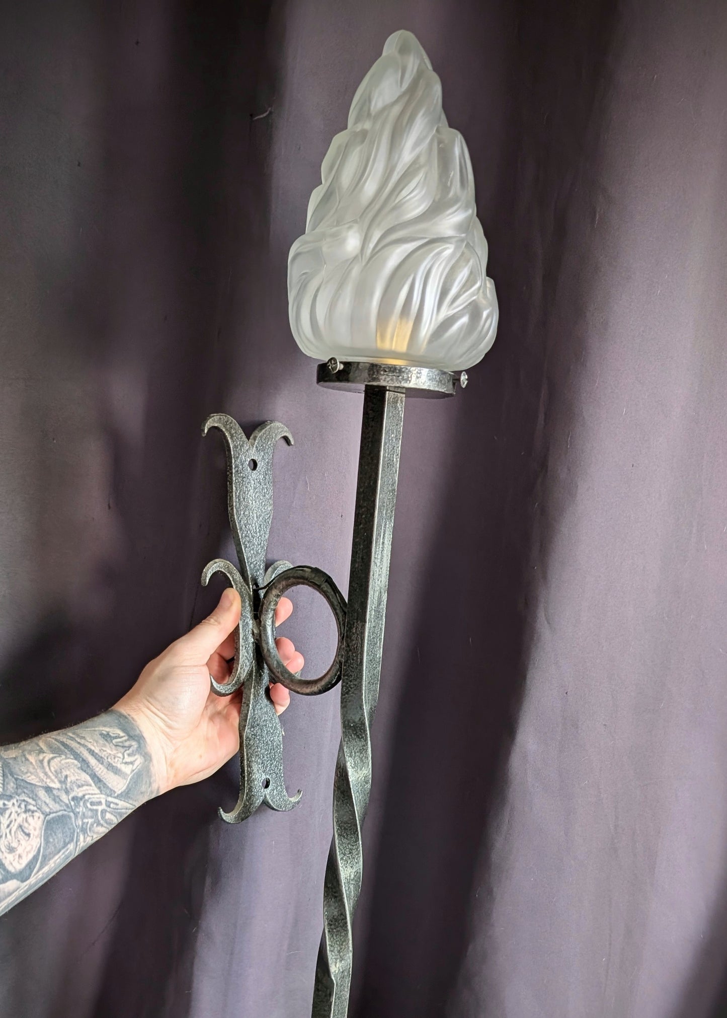 Wrought iron torch with glass flame