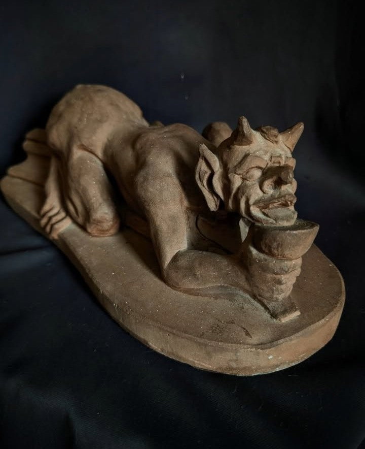 Sculpture of the Devil with a chalice (made of church stone)