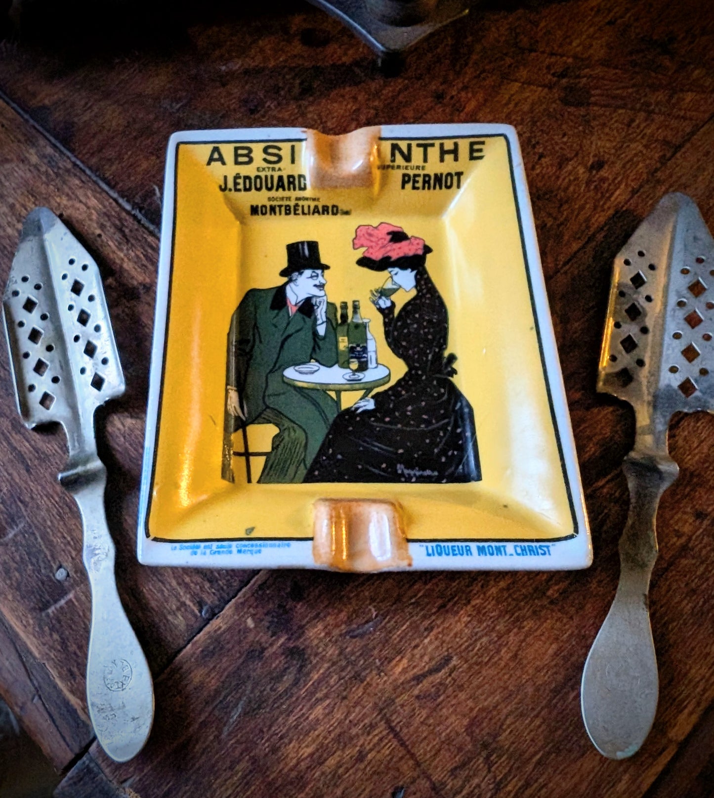 Absinthe Pernot ashtray and two antique spoons from the early 20th