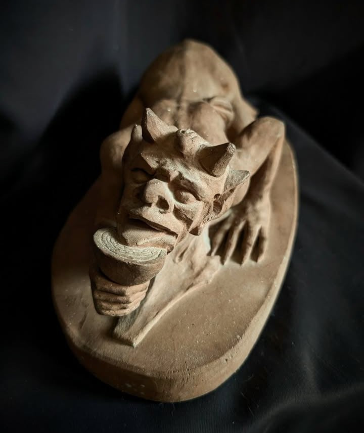 Sculpture of the Devil with a chalice (made of church stone)