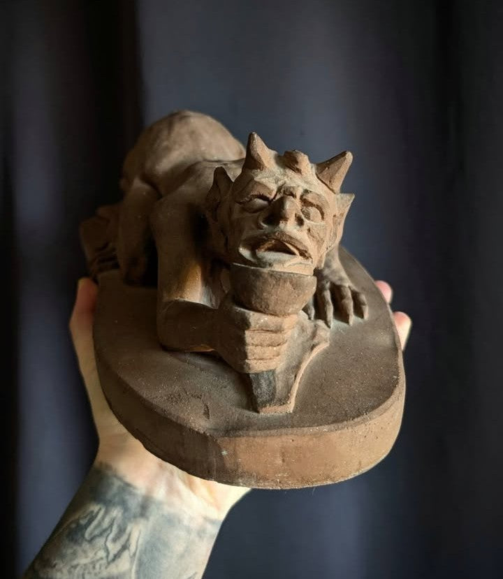 Sculpture of the Devil with a chalice (made of church stone)