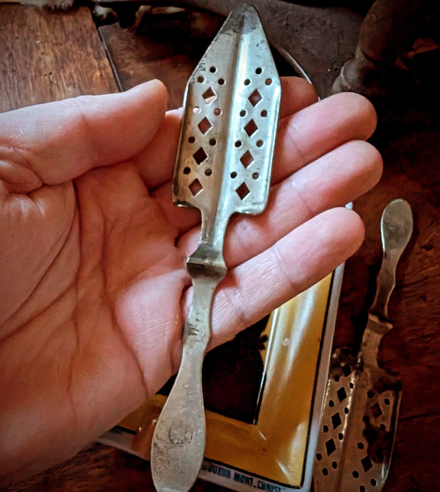 Absinthe Pernot ashtray and two antique spoons from the early 20th
